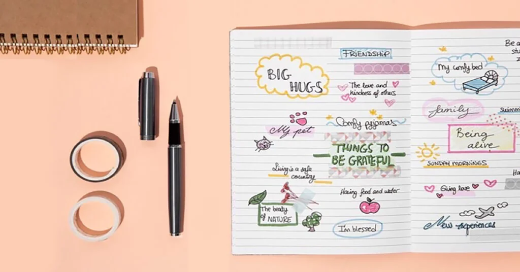 An open notebook for simple journaling showing a colorful gratitude list with doodles, notes on friendship, and things to be thankful for.